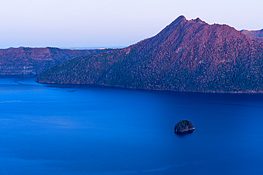 Calm purple evening light, of blue hour, deep blue Lake Mashu in a crater, Akan Mashu National Park, Hokkaido, Japan, Asia