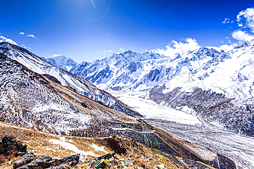 Expansive view across glacier-carved Langtang Valley with snowy slopes and rugged Himalayan peaks near Kyanjin Gompa, Nepal
