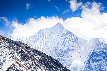 Spectacular View of Gangchempo Glaciated Pyramid Rising Above Snowy Slopes from Kyanjin Ri Summit in the Langtang Valley, Nepal