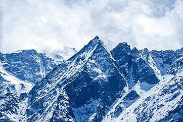 Sharp Profile of Naya Kanga (Ganja La Peak) Surrounded by Rugged Langtang Ridges Seen from Kyanjin Ri Summit in Nepal’s Himalayas