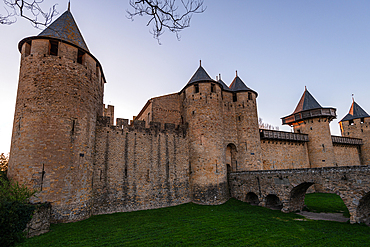 Evening view of the outer ramparts and towers of Château Comtal in the UNESCO-listed Cité de Carcassonne