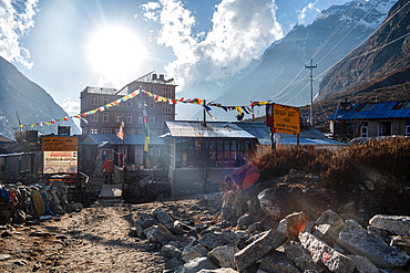 Bright Mundu village surrounded by high Himalayan walls of Langtang Valley