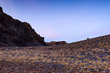 Dusky light over the barren rocky slopes of Cerro del Caballo, the westernmost 3000m peak in the Sierra Nevada, Andalusia, Spain.