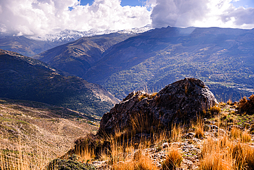 Rocky ridges and high peaks of the Sierra Nevada National Park above the village of Güéjar Sierra, Granada province, Andalusia, Spain.