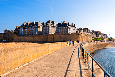 Seaside walkway along the fortified walls of Saint-Malo, Brittany, France, with panoramic views of the historic walled city