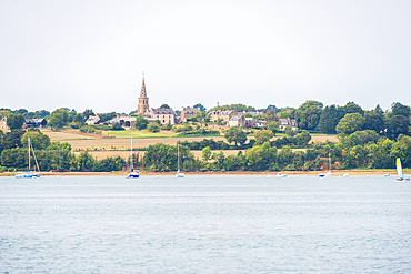illage church spire above green hills overlooking the Rance River. Vale de Rance, Brittany, France