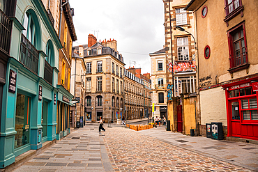 Picturesque cobblestone street with colorful medieval half-timbered houses in old town Rennes Brittany France