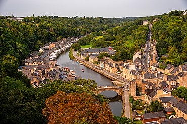 Wide aerial view of Dinan showing the River Rance, stone houses, Dinan port and le vieux pont,Brittany France
