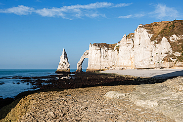 Étretat chalk cliffs and famous sea stack L’Aiguille on the Normandy coast France