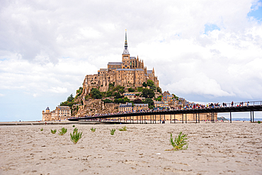 Iconic view of Mont Saint-Michel rising above the tidal sands, Normandy, France.