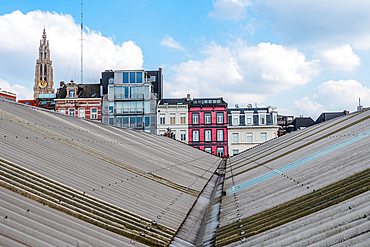 View over the modern roof structure of the MAS Museum (Museum aan de Stroom) with the Cathedral of Our Lady in the background, Antwerp, Belgium