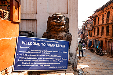 Entrance sign to Bhaktapur old town area with Lion Statue guarding the alley, Bhaktapur, Nepal, Asia