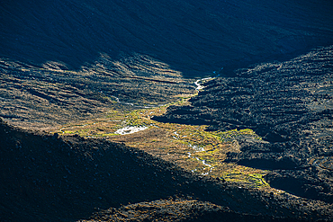 Aerial close up of a sunlit creek surrounded by volcanic ash, Tongariro National Park, UNESCO World Heritage Site, North Island, New Zealand, Pacific