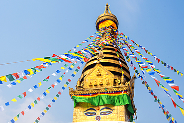 Blue sky and prayer flags at large Swayambhu (Swayanbhunath) Stupa, UNESCO World Heritage Site, Kathmandu, Nepal, Asia