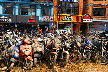 Bunch of motor bikes covered in dust in front of building, Kathmandu, Nepal, Asia