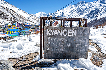 Signposts to the summits in the snow. Kyanjin Gompa, Langtang Valley trek, Himalayas, Nepal, Asia