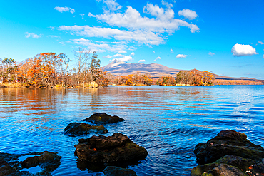 Beautiful Lake Onuma with rocks and tree islands reflecting, in autumn, near Hakkodate, Hokkaido, Japan, Asia