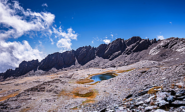 Dramatic rugged mountain range with a lake, Laguna del Rio Secco and Pico del Pulpito, Sierra Nevada, Andalusia, Spain, Europe