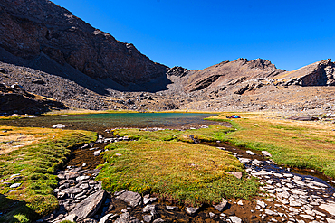 Mountain lake, Laguna Larga, at the foot of Mulhacen, Spain's highest mountain in the Sierra Nevada, Andalusia, Spain, Europe