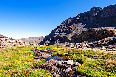 Mountain lake, Laguna Larga, at the foot of Mulhacen, Spain's highest mountain in the Sierra Nevada, Andalusia, Spain, Europe