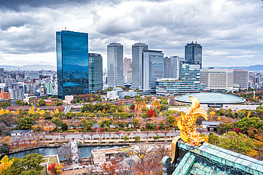 View from the top floor of Osaka Castle with the park and business city sector and a golden fish roof detail, Osaka, Honshu, Japan, Asia