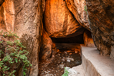 Path leading under the red rock cliffs of Los Cahorros Monachil, Monachil, Sierra Nevada, Granada, Andalusia, Spain, Europe