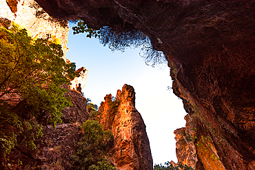 Looking up at the steep red cliffs from the suspension bridge in the gorge of Los Cahorros Monachil, Monachil, Sierra Nevada, Granada, Andalusia, Spain, Europe