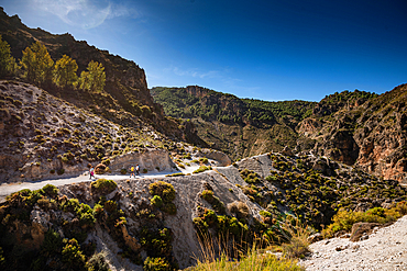 Hiking trail in the arid gorge canyon landscape of Los Cahorros Monachil, Monachil, Sierra Nevada, Granada, Andalusia, Spain, Europe