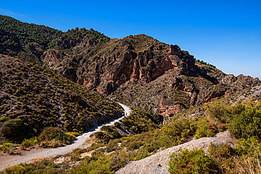 Hiking trail in the arid gorge canyon landscape of Los Cahorros Monachil, Monachil, Sierra Nevada, Granada, Andalusia, Spain, Europe