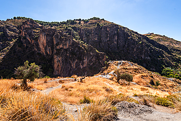 Hiking trail in the arid gorge canyon landscape of Los Cahorros Monachil, Monachil, Sierra Nevada, Granada, Andalusia, Spain, Europe