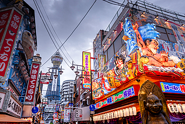 Shinsekai District and Tsutenkaku Tower in the evening with colorful neon lights of restaurants, Osaka, Honshu, Japan, Asia