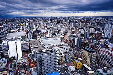 View from Tsutenkaku Tower in the Shinsekai area, of city skyline and dramatic sky, Osaka, Honshu, Japan, Asia