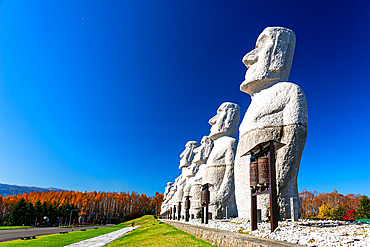 Moai statues against a blue sky, Makomanai Takino Cemetery, Hill of the Buddha, Sapporo, Hokkaido, Japan, Asia