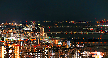 Highway and railway bridges crossing the Yodo River, night skyline, Osaka, Honshu, Japan, Asia