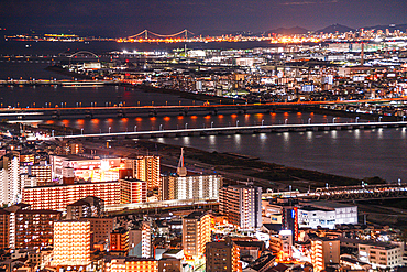 Night Skyline of Osaka, Japan. Highway and Train bridges crossing the Yodo River