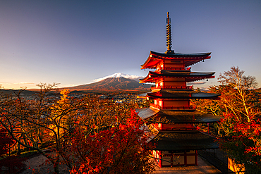 Vibrant sunrise at Five-storey pagoda, Chureito Pagoda, overlooking Fujiyoshida City and Mount Fuji volcano, Fujiyoshida, Honshu, Japan, Asia