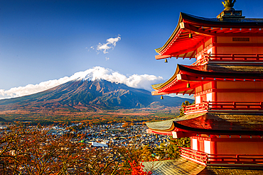 Vibrant sunrise at Five-storey pagoda, Chureito Pagoda, overlooking Fujiyoshida City and Mount Fuji Volcano. Japan. Autumn in Japa