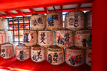 Sake barrels with traditional paintings, at Itsukushima Shrine on Miyajima Island near Hiroshima. Japan Tempel shinto. Famous shrine with floating torii Otori