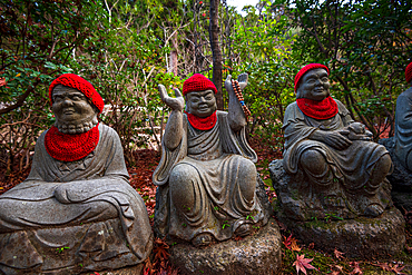 Daishoin Temple with hundreds of detailed buddhist statues wearing red hats. Miyajima Island near Hiroshima. Japan Tempel shinto.