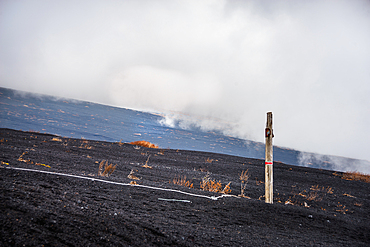 Hiking path in the ashes of mount Fuji in a fog cloud, Japan Volcano