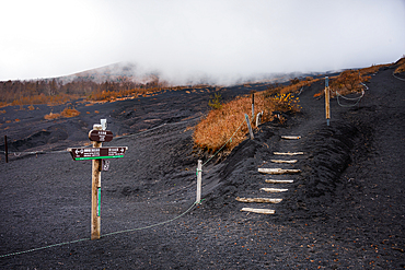 Hiking path in the ashes of Mount Fuji in a fog cloud, Honshu, Japan, Asia