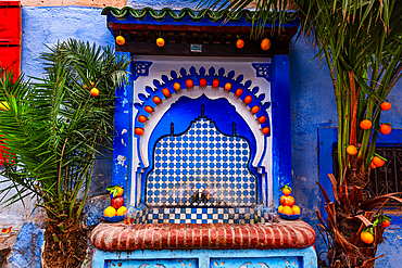 Typical blue fountain by houses in the Medina of Chefchaouen (The Blue City), Morocco