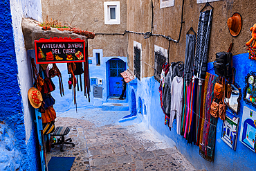 Street with craft goods displays and shops in Chefchaouen (The Blue City), Morocco