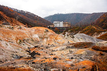 Volcanic sulphur pits in front of a hotel complex, Noboribetsu, Hokkaido, Japan, Asia