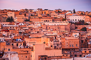 Warm purple Sunrise over the Medina of Fes, Morocco. Looking at the central old town close up