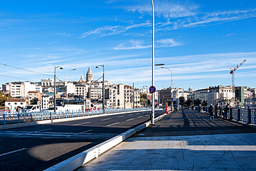 Cityscape from the Galata Bridge, spanning the Golden Horn, an arm of the sea, with the New Mosque (Yeni Cami), an Ottoman imperial mosque and landmark in the background, Istanbul, Turkey, Europe