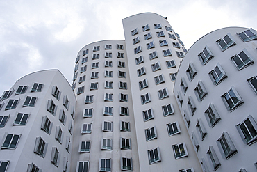 View of the Neuer Zollhof (The New Zollhof), named after a former customs facility, a building ensemble in the Medienhafen and prominent landmark of Dusseldorf-Hafen, part of the redeveloped port of Dusseldorf, Dusseldorf, North Rhine Westphalia, Germany, Europe