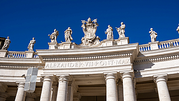 Detail of Doric colonnades in St. Peter's Square framing the entrance to St. Peter's Basilica, Vatican City, the papal enclave in Rome, UNESCO World Heritage Site, Rome, Lazio, Italy, Europe