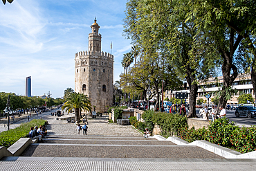 Cityscape of Seville, with the Torre del Oro (Tower of Gold), a dodecagonal military watchtower built by the Almohad Caliphate by the Guadalquivir River, Seville, Andalusia, Spain, Europe