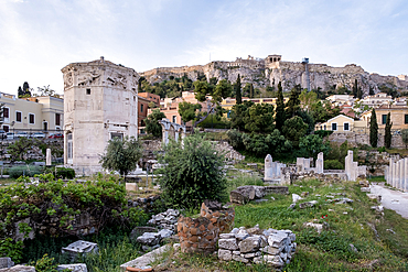 Sunrise view of the Roman Agora, showcasing the Tower of the Winds, an octagonal Pentelic marble clock tower, with the Acropolis in the background, Athens, Greece, Europe